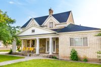 Large white multi story house