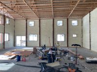 Spray foam insulation of the walls of a pole barn