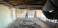 Spray foam insulation on walls of a a crawl space