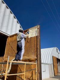 Magic Valley Spray applying spray foam to a potato cellar